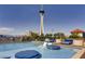 Rooftop pool area with lounge chairs and views of the Stratosphere Tower at 200 W Sahara Ave # 2407, Las Vegas, NV 89102