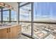 Bathroom vanity with expansive city views through floor-to-ceiling windows at 200 W Sahara Ave # 2407, Las Vegas, NV 89102