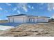 Attractive single-story home features a three-car garage, tile roof, and well-lit entryway at 2201 W Wisteria Way, Pahrump, NV 89048