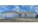 Lovely single-story home with a three-car garage and inviting arched entryway at 2201 W Wisteria Way, Pahrump, NV 89048