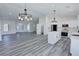 Open concept living space with an island kitchen and lots of light at 2201 W Wisteria Way, Pahrump, NV 89048