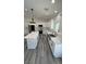 New kitchen with stainless appliances, countertops, and island with sink at 2201 W Wisteria Way, Pahrump, NV 89048