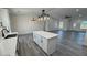 Stylish kitchen island complements countertops, cabinets and stainless appliances at 2201 W Wisteria Way, Pahrump, NV 89048