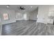 Open living space with ample natural light, gray floors, and modern design at 2201 W Wisteria Way, Pahrump, NV 89048