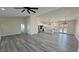 Expansive open living area with contemporary gray flooring, and an open-concept design at 2201 W Wisteria Way, Pahrump, NV 89048