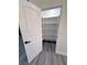 Bright pantry features ample white shelving and contemporary gray wood flooring at 2201 W Wisteria Way, Pahrump, NV 89048