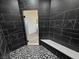 Modern shower featuring marble look tile, bench and hexagon tile floor at 2201 W Wisteria Way, Pahrump, NV 89048