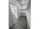 Bright walk-in closet features wood-look tile flooring and storage shelving at 2201 W Wisteria Way, Pahrump, NV 89048
