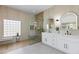 Modern bathroom boasts double vanity, large walk-in shower with natural light, and tile surround at 2317 Sierra Heights Dr, Las Vegas, NV 89134