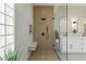 Modern bathroom showcasing a glass enclosed shower with a bench and neutral toned tile at 2317 Sierra Heights Dr, Las Vegas, NV 89134