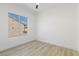 Clean, bright bedroom with a window overlooking a neighboring home and side yard at 2317 Sierra Heights Dr, Las Vegas, NV 89134