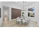 Bright dining room featuring modern chandelier, seating for six, and an accent wall at 2317 Sierra Heights Dr, Las Vegas, NV 89134