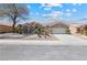 Charming single-story home with a desert landscape, a two-car garage, and a manicured lawn at 2317 Sierra Heights Dr, Las Vegas, NV 89134
