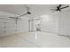 Spacious two car garage features an epoxy floor, large cabinets and ceiling fan at 2317 Sierra Heights Dr, Las Vegas, NV 89134