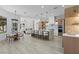 Open-concept kitchen with eat-in island, wood cabinetry, and stainless steel appliances at 2317 Sierra Heights Dr, Las Vegas, NV 89134