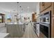 Spacious kitchen overlooking the backyard with an island, modern appliances, and golf course views at 2317 Sierra Heights Dr, Las Vegas, NV 89134