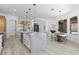 Bright, open kitchen with a large island, stainless steel appliances, and modern pendant lighting at 2317 Sierra Heights Dr, Las Vegas, NV 89134