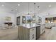 Open kitchen with a large island, modern appliances, and access to the backyard at 2317 Sierra Heights Dr, Las Vegas, NV 89134
