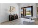 Stylish living room featuring access to a covered patio and views of lush landscaping at 2317 Sierra Heights Dr, Las Vegas, NV 89134