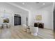 Open concept living area showcasing light wood floors and modern furnishings, providing ample seating at 2317 Sierra Heights Dr, Las Vegas, NV 89134