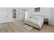 Bright main bedroom showcasing contemporary decor, wood-look floors, and neutral color palette at 2317 Sierra Heights Dr, Las Vegas, NV 89134