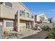 Exterior of a home with a backyard, showcasing a gravel area and a small balcony above at 2509 April Breeze Ln, Henderson, NV 89002