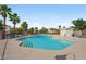 Enjoy this inviting community pool surrounded by mature trees and comfortable lounge chairs at 2509 April Breeze Ln, Henderson, NV 89002