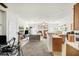 An open living room space leads into the kitchen with plenty of natural sunlight at 2509 April Breeze Ln, Henderson, NV 89002