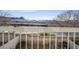 Balcony area with view of mountains and desert landscape, enclosed by a decorative metal railing at 2509 April Breeze Ln, Henderson, NV 89002