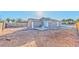 View of the backyard featuring low maintenance ground cover and a small patio at 2708 Bello Dr, North Las Vegas, NV 89030