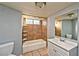 Simple bathroom with tiled shower/tub combo and single sink vanity at 2708 Bello Dr, North Las Vegas, NV 89030