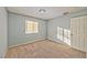 Cozy bedroom with blue walls, carpeted floors, and a window that brightens the room at 2708 Bello Dr, North Las Vegas, NV 89030