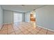 Open living room with tile flooring and access to the kitchen at 2708 Bello Dr, North Las Vegas, NV 89030