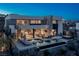 Gorgeous backyard featuring a pool, lounge chairs, spiral staircase and serene outdoor living space at 29 Falling Ridge Ln, Henderson, NV 89011