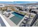 A backyard pool with a hot tub, fire pit, and lounge chairs perfect for outdoor entertaining and relaxation at 29 Falling Ridge Ln, Henderson, NV 89011