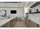 Modern bar with sleek countertops, wine storage, and stainless steel appliances at 29 Falling Ridge Ln, Henderson, NV 89011