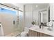 Bright bathroom with modern fixtures, a sleek vanity, and a glass-enclosed shower at 29 Falling Ridge Ln, Henderson, NV 89011