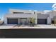 Contemporary home showcases a clean facade, two-car garage, modern landscaping, and sleek architectural design at 29 Falling Ridge Ln, Henderson, NV 89011