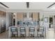Bright kitchen featuring a large island with bar seating, stainless steel appliances, and modern cabinetry at 29 Falling Ridge Ln, Henderson, NV 89011