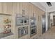 Modern kitchen with built in stainless steel appliances, custom cabinets and accent lighting at 29 Falling Ridge Ln, Henderson, NV 89011