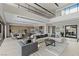 Spacious living room with modern décor, plush seating, and an open floor plan filled with natural light at 29 Falling Ridge Ln, Henderson, NV 89011