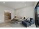 Cozy living room with contemporary furnishings and a view of the adjacent kitchenette at 29 Falling Ridge Ln, Henderson, NV 89011