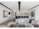 Open concept living space including a bar area, TV and comfortable seating at 29 Falling Ridge Ln, Henderson, NV 89011