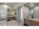 Luxurious bathroom features dual vanities, modern fixtures, and tile flooring at 29 Falling Ridge Ln, Henderson, NV 89011