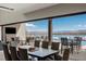 Outdoor dining with lake views, luxury furnishings, and pool at 29 Falling Ridge Ln, Henderson, NV 89011