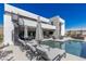 Outdoor living space with pool, spiral staircase and lounge chairs at 29 Falling Ridge Ln, Henderson, NV 89011