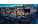 Stunning modern home featuring a luxurious pool, spa, and outdoor entertaining area with comfortable seating at 29 Falling Ridge Ln, Henderson, NV 89011