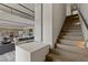 Staircase leads to living space with open floor plan, accented by a stone column at 29 Falling Ridge Ln, Henderson, NV 89011