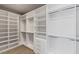 Spacious walk-in closet with custom shelving, drawers, and ample storage space at 29 Falling Ridge Ln, Henderson, NV 89011