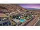 Beautiful modern homes sit hillside with pools and views of the city lights in the distance at 302 Watteau Ct, Henderson, NV 89012